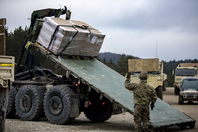 Sgt. Marquies Cotton and Spc. Devin Reyes, Army Motor Transport Operators from 51st Composite Truck Company, 18th Combat Sustainment Support Battalion,  deliver Meals, Ready-to-Eat (MREs) to 1st Air Cavalry Brigade Troopers on Jan. 26  during Allied Spirit. 