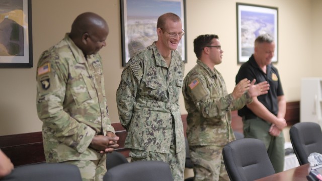  The 597th Transportation Brigade operations section gathered to bid farewell and present awards to 597th Transportation Brigade Operations Chief Lt. Col. Julio Reyes during a farewell get together at Joint Base Langley-Eustis, Va. May 31.