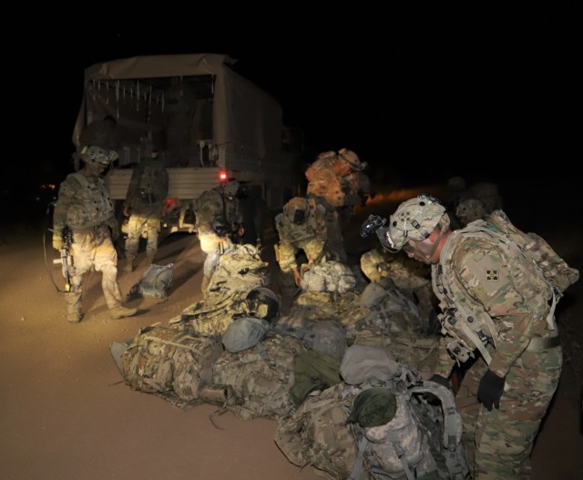 Soldiers of 2nd Battalion, 12th Infantry Regiment, 2nd Infantry Brigade Combat Team, 4th Infantry Division offload a vehicle during a training exercise on Sept. 24. 2019, at Training Area 5 at Fort Carson, Colorado . The Soldiers were transported to their helicopter landing zone by vehicles of  Soldiers of 68th Combat Sustainment Support Battalion, 4th Sustainment Brigade, 4th Infantry Division prior to an air assault exercise. 