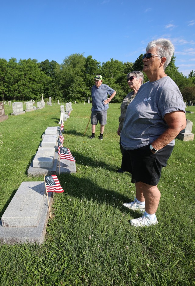 Families walk cemeteries at Fort Knox in search of relatives during Memorial Day visitation