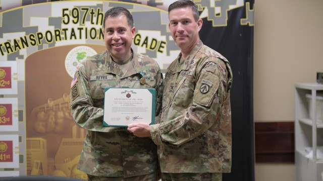 Col. Jeremy St. Laurent presents the Army Commendation Medal to  Lt. Col. Julio Reyes at Joint Bae Langley-Eustis, Va. May 31.