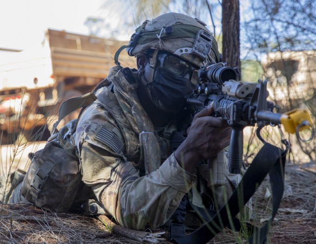 A Soldier with 325th Brigade Support Battalion, 25th Infantry Division, reacts to indirect fire during a convoy movement as part of a Home Station Combat Training Center brigade level collective training event on Oct. 20, 2021, at the Joint...