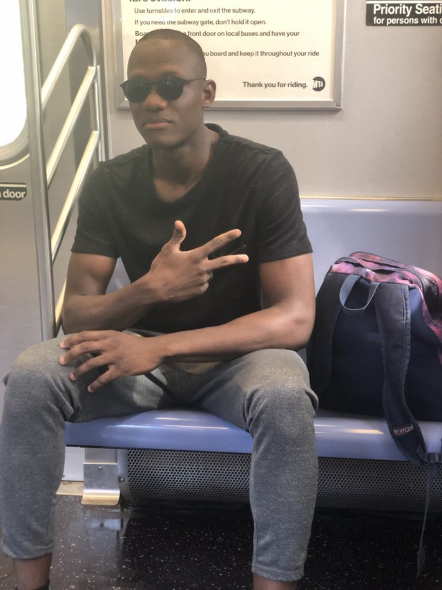 Toure riding the subway in New York City. 