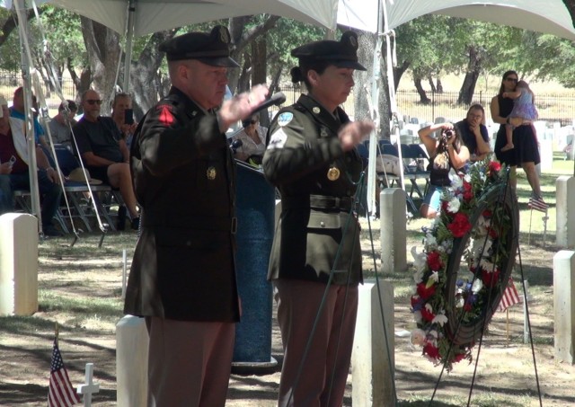 (left) Maj. Gen. Anthony Hale, Commanding General, U.S. Army Intelligence Center of Excellence & Fort Huachuca, and Command Sgt. Maj. Tammy Everette honor America’s Veterans and fallen service members at the Post Cemetery on Memorial Day 2022.  