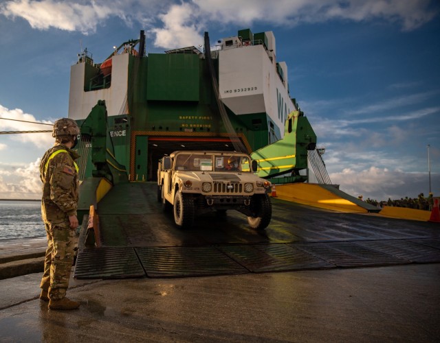 A vehicle belonging to 1st Air Cavalry Brigade (1ACB), 1st Cavalry Division (1ID), is driven down the rear ramp of the commercial vessel ARC Independence Nov. 28, 2021, at the port of Alexandroupoli,Greece, in support of Atlantic Resolve.