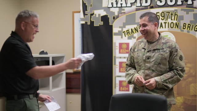  597th Transportation Brigade Operations Chief Lt. Col. Julio Reyes was presented cloth masks  during a farewell get together at Joint Base Langley-Eustis, Va. May 31.