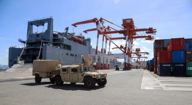 Military vehicles originating from the 402nd Army Field Support Battalion are downloaded from U.S. Navy Ship Red Cloud in preparation of Army Prepositioned Stock 3 on Feb. 24 at Subic Bay, Philippines .