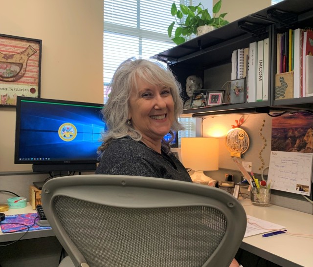 photo of female working at desk