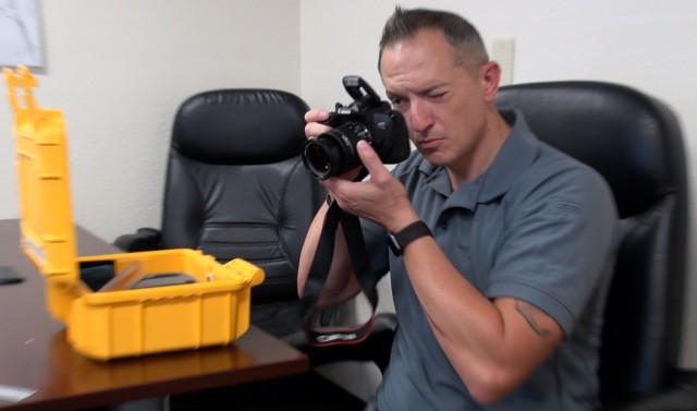 LT Andrew Deimund prepares a camera for an upcoming investigation.