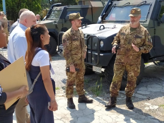 Italian Army Colonel Alberto Baessato of Julia logistic regiment in Merano, Italy, explains their mission to U.S. members of the Logistics Readiness Center Italy, based out of Caserma Ederle on May 19. 