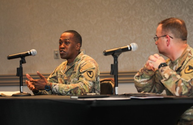 Command Sgt. Maj. Justin E. Turner, left, senior enlisted leader for U.S. Army Garrison Japan, and Col. Christopher L. Tomlinson, right, commander of USAG Japan, address questions during a quarterly town hall on housing at the Camp Zama Community Club, Japan, June 1, 2022. 