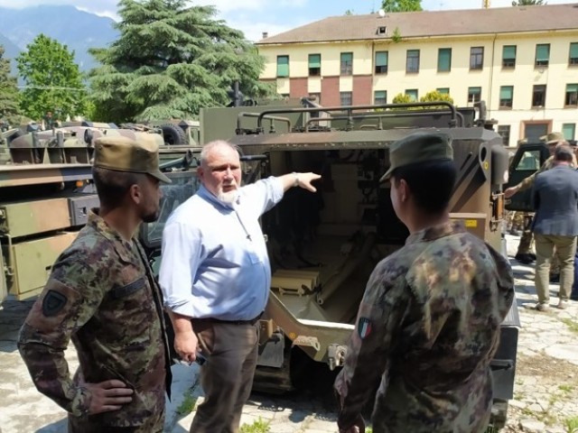 Italian soldiers from the “Julia” logistic regiment in Merano, Italy, show Bobby White Jr.  of the Logistics Readiness Center Italy, based out of Caserma Ederle on May 19. 