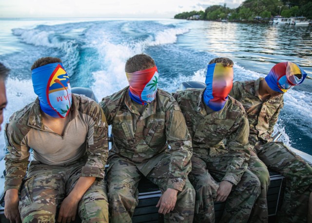 Blindfolded competitors are taken on a boat to an island during the Region VII Best Warrior Competition on Guam May 26, 2022. This annual competition featured the best noncommissioned officer and Soldier from Arizona, California, Colorado, Guam, Hawaii, Nevada, New Mexicoand Utah. (U.S. Army National Guard photo by Staff Sgt. Jordan Hack)