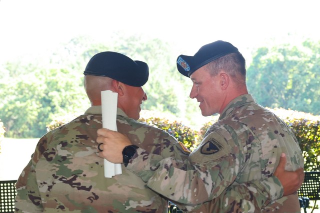 FORT BENNING, Ga.- Command Sergeant Major Brett W. Johnson relinquishes responsibility of the Fort Benning Garrison to Command Sergeant Major Michael D. Sanchez , June 03, 2022, at The Fort Benning Golf Course.  (U. S. Army Photos by Markeith Horace/ Maneuver Center of Excellence Public Affairs Photographer)