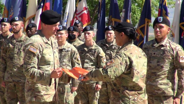The leaders of Charlie Company, 40th Expeditionary Signal Battalion case the company guidon as the unit inactivates at Fort Huachuca, Ariz.