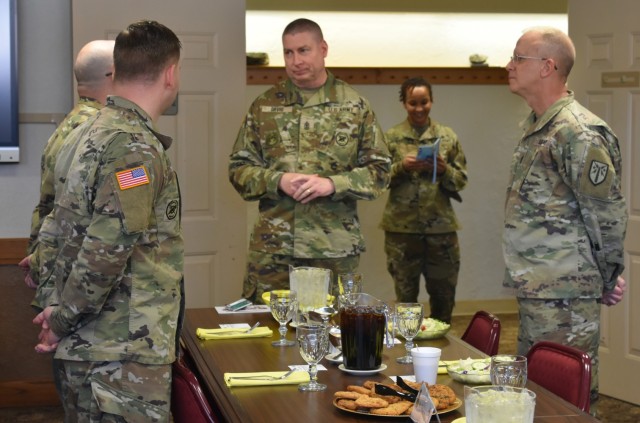 U.S. Army Sgt. Maj. Larry Orvis, center, the Inspector General Sergeant Major, speaks with inspectors general assigned to Fort Sill, Oklahoma, March 15, 2022, as part of the New Soldier Experience pre-inspection visit there. The New Soldier Experience inspection is designed to assess the Army’s ability to train, integrate and retain first-term Soldiers. 