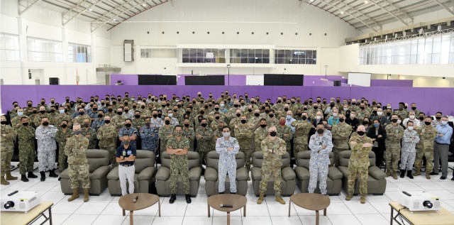 Participants in the eighth annual Bersama Warrior exercise pose for a group photo during the opening ceremony in Kuantan, Malaysia, June 6, 2022. Bersama Warrior is an annual joint and bilateral exercise sponsored by U.S. Indo-Pacific Command and hosted by the Malaysian Armed Forces. (Photo courtesy of Malaysian Armed Forces)