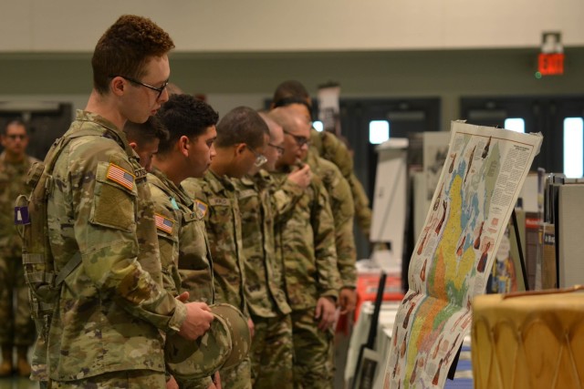 Trainees from Company C, 3rd Battalion, 10th Infantry Regiment, learn about the diverse cultures and people in American history during the Army Heritage exhibition, hosted by the Fort Leonard Wood Equal Opportunity Office Friday at Nutter Field House.