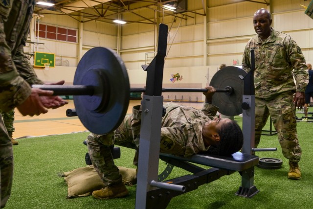 Staff Sgt. Cherise Clark, NCO in charge of current operations for the 554th Engineer Battalion, competes in the bench press event of the Diversity in Strength weightlifting challenge Friday at Swift Gym.