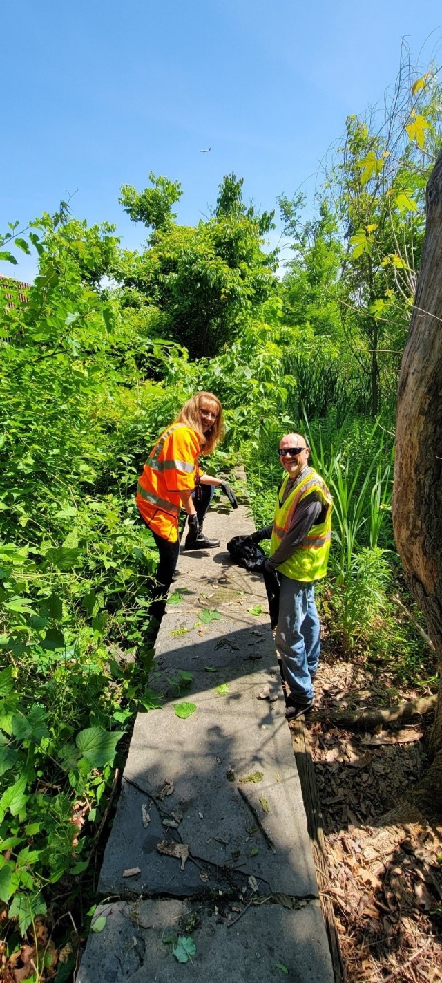 Lisa Taylor and Tony Taylor (JBM-HH) cleaning up the area along the historic border wall. 