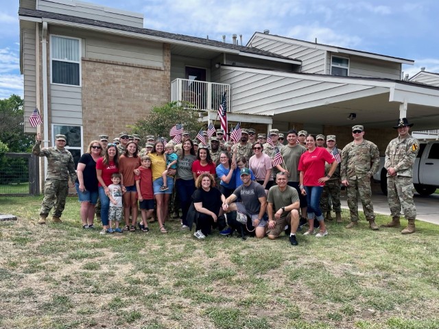 FORT HOOD, Texas-- Soldiers, friends and family of the 2-227 GSAB FRG gather together with &#34;Moving with the Military&#34; to remodel and reoutfit the home of Mrs. Heather Simpson and Sgt. Matthew Simpson after an unfortunate flood in their previous home. (Courtesy photo)
