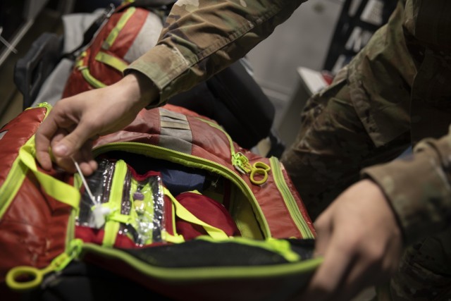 Spc. Seth Sabisch, an Oklahoma National Guard Soldier with 120th Medical Company (Area Support), 120th Engineer Battalion, 90th Troop Command preps a medical kit during a ride-along with EMSA in Tulsa, Oklahoma, June 08, 2022. The 120th MCAS is...
