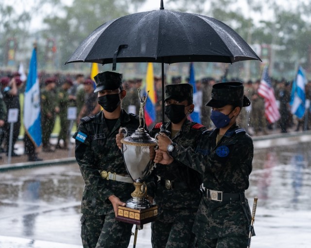 Cadets from the Honduras military carry the Fuerzas Comando 2022 trophy off the field during the opening on June 13, 2022, in Tegucigalpa, Honduras. Honduras hosts the event from June 13-23. Over 110 security forces personnel from 17 countries, including the United States, participated in the challenging contest, promoting military-to-military relationships, increasing training knowledge, and improving regional security.