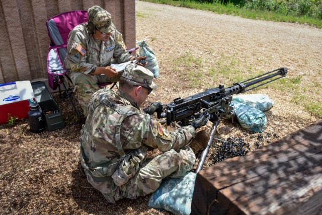 2nd Lt. Adam Cain, a platoon leader with Company A, 31st Engineer Battalion, performs a functions check on the M2 .50 Caliber machine gun, while Sgt. 1st Class David Riojas, a platoon leader with Company A, 1st Battalion, 18th Infantry Regiment, Fort Riley, Kansas, grades him during the weapons portion of Expert Soldier Badge testing June 7 at Fort Leonard Wood. More than 200 Soldiers from Fort Leonard Wood and installations as far away as Hawaii and Florida tested for their Expert Infantryman and Expert Soldier skill badges from June 6 to Friday here. 