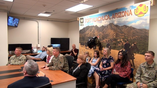CoL. Jarrod Moreland, Commander, U.S. Army Garrison-Fort Huachuca, members of the community,  and his family watch the video conference presentation of the 2022 Commander in  Chief’s Award for Installation Excellence that is being presented to the post.