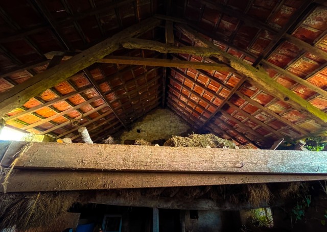 Straw fills the loft where Madame Brisset hid three American paratroopers from enemy patrols on June 6, 1944. (U.S. Army photo by Maj. Robert Fellingham)