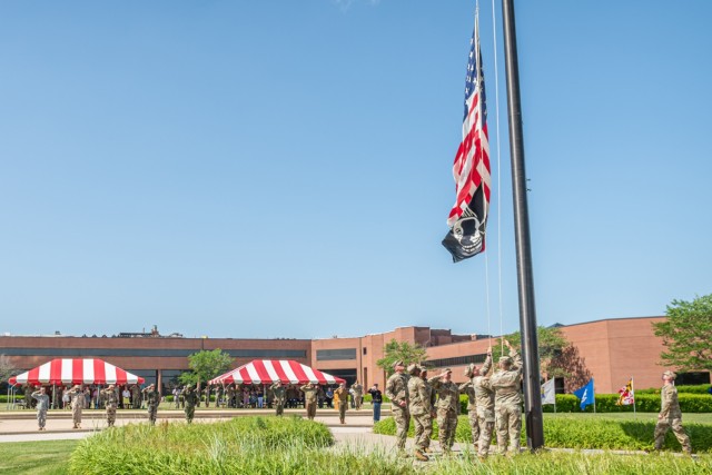 Soldiers attending the Maneuver Support Center of Excellence NCO Academy lower the flag during a Retreat ceremony Tuesday in the MSCoE Plaza as part of Fort Leonard Wood&#39;s Army Birthday celebrations.
