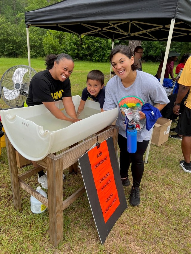 The youngest person to use the AICS was four-year old Javier Vigil.  Javier and his mother, Bianca Vigil, had just completed the 5K walk.  Drill Sergeant Candidate, Staff Sgt. Shanda Williams, also cooled off in the AICS.