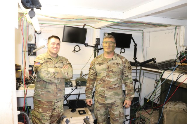 Staff Sgt. John Mock, 3/2 S6 in charge of the Integrated Tactical Network’s Capability Sets 21 and 23 integration into the unit’s Stryker vehicles and dismounted capabilities Sgt. Maj. Christian Bearden, in charge of the unit’s operations processes and main command post, Grafenwohr Training Area, meet in the command post during the unit’s live fires exercise to discuss the concurrent Ops Demo Phase 1, designed to provide Army Network leaders and developers with feedback and data. 