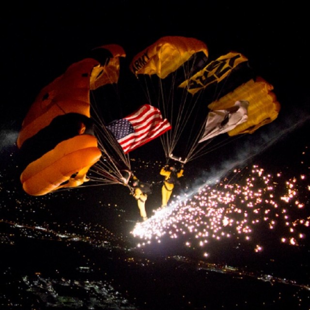 Members of the U.S. Army Parachute Team display a pyrotechnic side-by-side formation during winter training. The Golden Knights will make their first jump into Redstone Arsenal, June 11 for the 247th Army Birthday Celebration. 