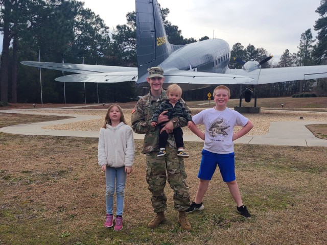 Sgt. Joby L. Forney, a chemical, biological, radiological and nuclear specialist assigned to 3rd Expeditionary Sustainment Command poses with his three children in 2021 before he deployed for nine months to Camp Arifjan, Kuwait. “I hope to pass on a sense of selflessness or a willingness to serve, whether it’s military or some type of role where you are putting the needs of others before your own,” said the Bend, Ore., native.