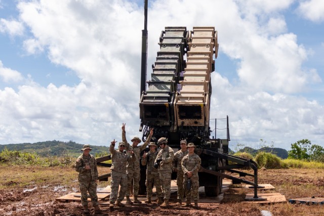 Hot Crew from Charlie Battery, 1-1 ADA BN poses by the launcher following the live-fire