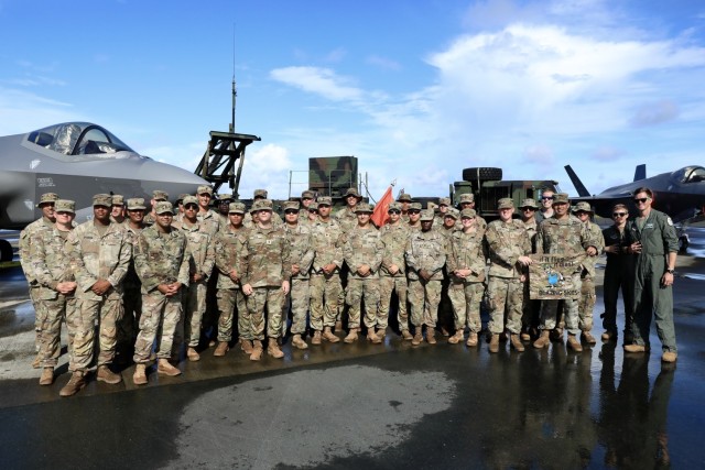 Soldiers from Charlie Battery, 1-1 ADA pose with F-35s and pilots from the US Air Force