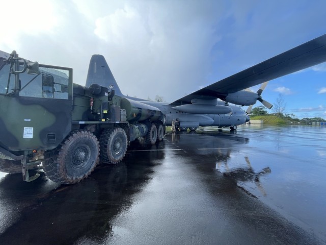 Fuelers from Charlie Battery, 1-1 ADA BN refuel an Air Force C-130 aircraft at Airai International Airport