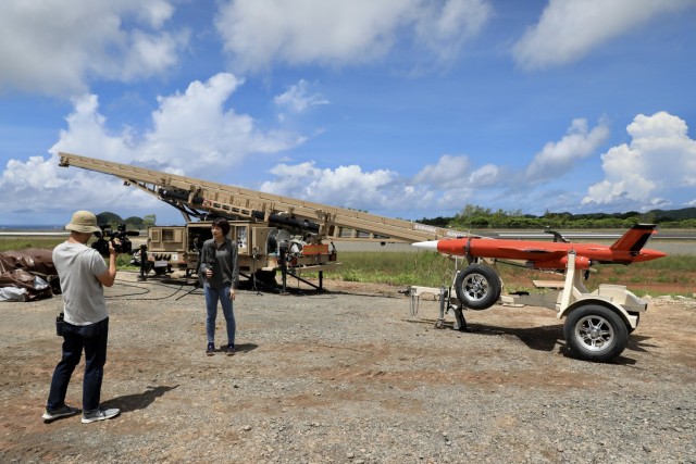 Midori Aoki of NHK-World conducts a stand-up in front of a target drone prior to the Patriot live-fire exercise during Valiant Shield 22