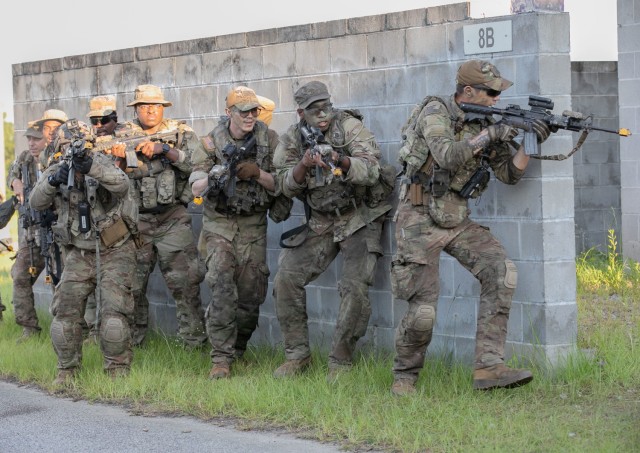 Georgia Army National Guardsmen with the 2nd Battalion, 121st Infantry Regiment, 48th Infantry Brigade Combat Team, stack against a wall during an Exportable Combat Training Capability Exercise at Fort Stewart, Ga, June 18, 2022. The exercise included approximately 4,400 brigade personnel from throughout Georgia. 
(U.S. Army photo by Staff Sgt. Jeron Walker)