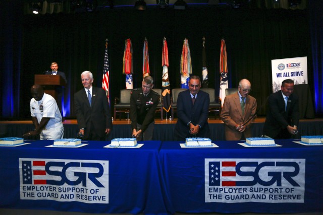 Army Gen. Daniel Hokanson, chief, National Guard Bureau, joins other distinguished guests cutting cakes during the Employer Support of the Guard and Reserve 50th Anniversary Commemoration in the Pentagon Auditorium in Washington June 22, 2022. ESGR is a Department of Defense program established in 1972 to promote cooperation and understanding between Guard and Reserve component service members and their civilian employers and to assist in the resolution of conflicts arising from an employee&#39;s military commitment. (U.S. Army National Guard photo by Sgt. 1st Class Zach Sheely)