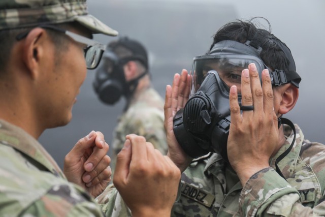 Capt. Jacob Melendez, right, and other Soldiers assigned to the 35th Combat Sustainment Support Battalion prepare to enter a gas chamber during a training event at the Combined Arms Training Center Camp Fuji, Japan, June 23, 2022. More than 60 Soldiers participated in the training, as part of a larger effort to increase readiness in the battalion.