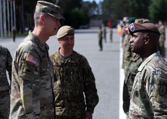 Army Gen. Daniel Hokanson, chief, National Guard Bureau, talks with multinational troops supporting a NATO mission, Ādaži Military Base, Latvia, June 16, 2022.