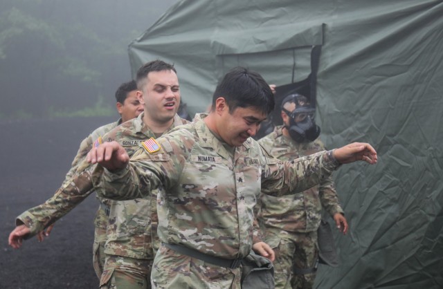 Soldiers assigned to the 35th Combat Sustainment Support Battalion exit a gas chamber during a training event at the Combined Arms Training Center Camp Fuji, Japan, June 23, 2022. More than 60 Soldiers participated in the training, as part of a larger effort to increase readiness in the battalion.