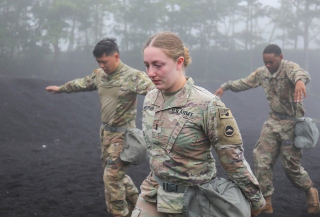 First Lt. Hannah Anderson and other Soldiers assigned to the 35th Combat Sustainment Support Battalion exit a gas chamber during a training event at the Combined Arms Training Center Camp Fuji, Japan, June 23, 2022. More than 60 Soldiers participated in the training, as part of a larger effort to increase readiness in the battalion.