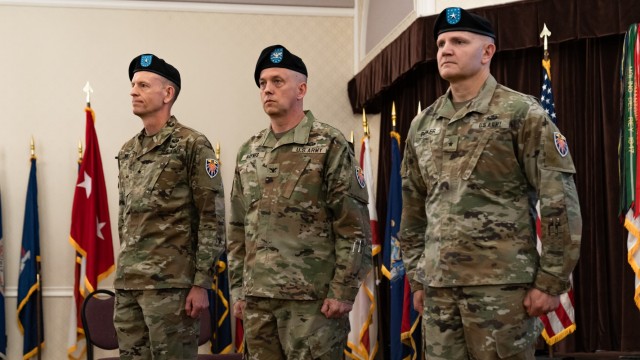 (From right) Brig. Gen. Charles R. &#34;Rob&#34; Parker&#34; 7th Signal Command (Theater) incoming commander, Col. Kenneth G. Hayes, 7th Signal Command (Theater) deputy commander and Brig. Gen. Mark D. Miles, outgoing 7th Signal Command (Theater) commander stand at attention at a change of command ceremony at Club Meade on Fort George G. Meade, Maryland, June 22, 2022. 