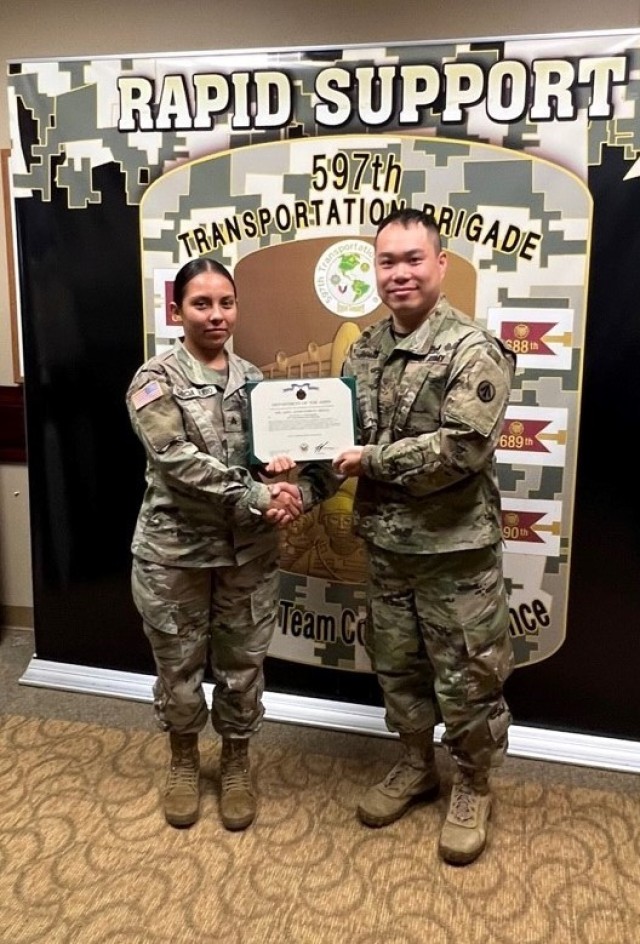 Maj. Yan Lok Tong presents the Army Achievement Medal to Sgt. Yoana Garcia at Joint Base Langley-Eustis, Va. June 24.