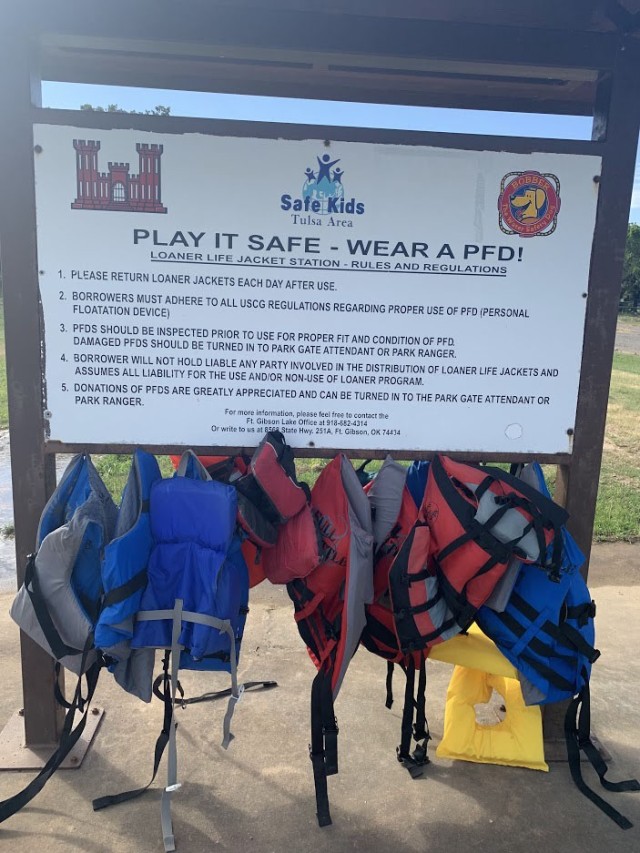 Life Jacket loaner station set up at the beach say use area for the public to have access to lifejackts during their visit.