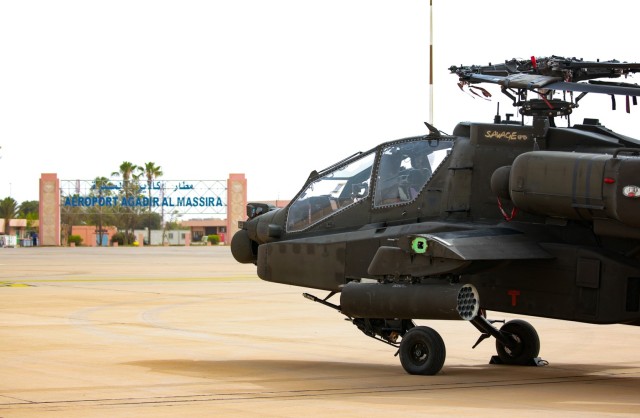 An AH-64 Apache helicopter from the 1-211th Aviation Regiment, Utah Army National Guard, waits to be taxied on June 20, 2022, at Agadir Al-Massira International Airport, Morocco. AL22 is U.S. Africa Command's largest, premier, joint, combined annual exercise hosted by Morocco, Ghana, Senegal, and Tunisia, June 6 - 30. More than 7,500 participants from 28 nations and NATO train together with a focus on enhancing readiness for U.S. and partner-nation forces. AL22 is a joint all-domain, multi-component, and multinational exercise, employing a full array of mission capabilities with the goal to strengthen interoperability among participants and set the theater for strategic access. (U.S. Army National Guard photo by Spc. Christopher Hall)