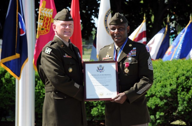 Maj. Gen. Darren Werner (left), commanding general, U.S. Army Tank-automotive and Armaments Command, presents Command Sgt. Maj. Jerry Charles a  Certificate of Retirement during a ceremony held at Detroit Arsenal June 24 for Charles. 